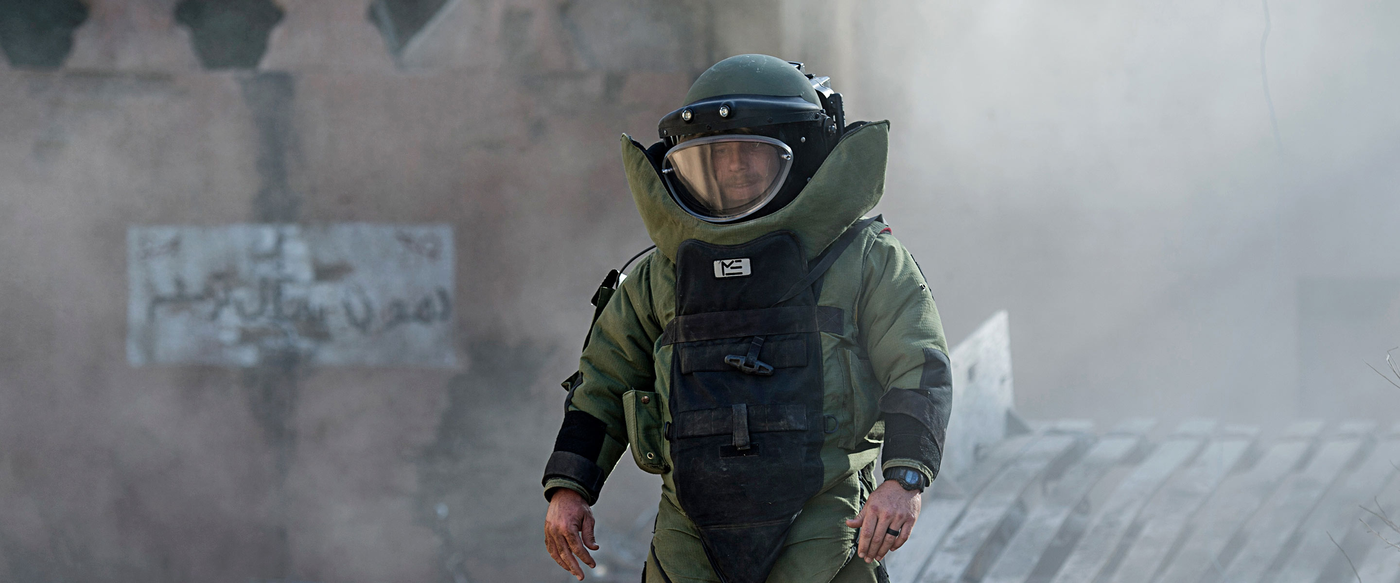 United States Navy Explosive Ordnance Disposal Technician suited up in a bomb suit