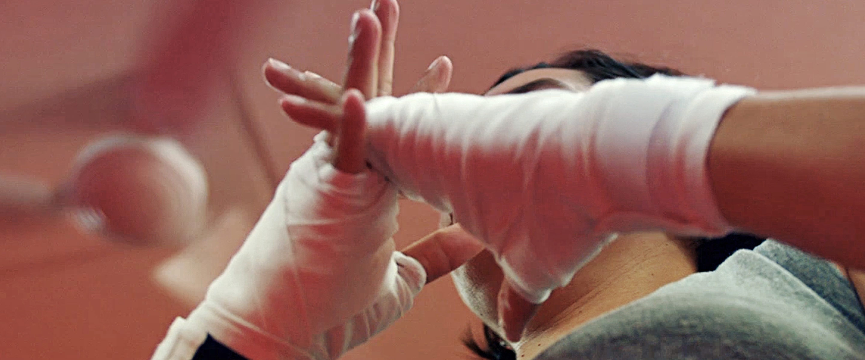 Cindy Huratiak, a Navy Machinist's Mate, wraps her hands to spar