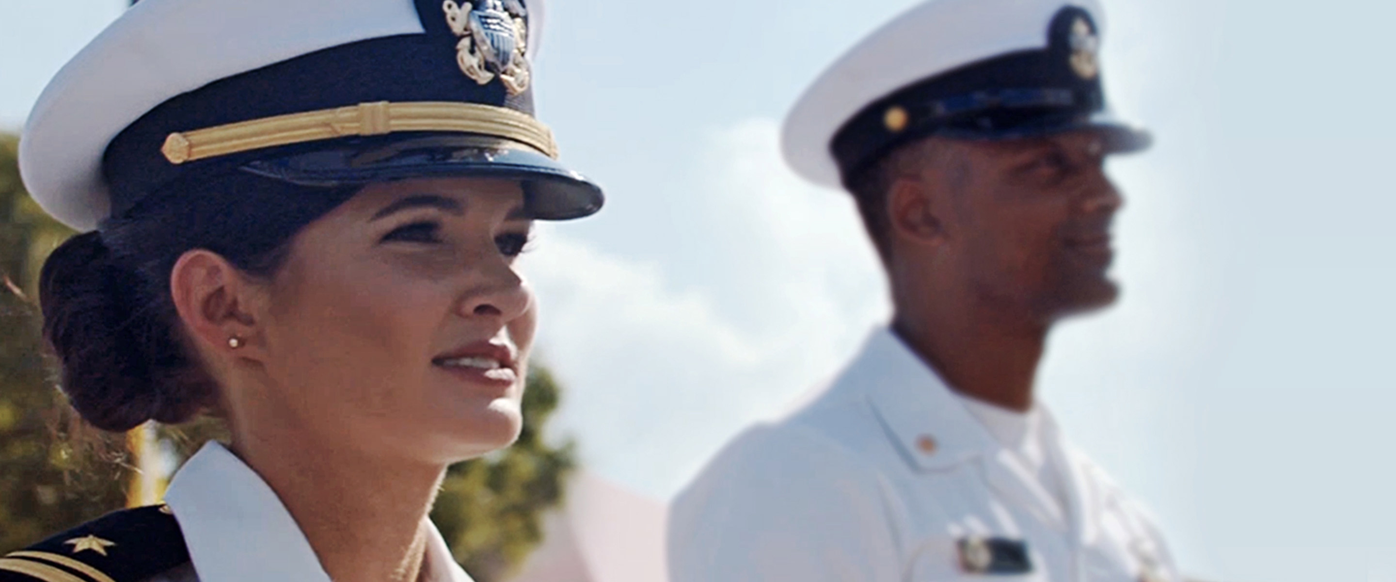 Two Navy officers including Lieutenant Kellie Hall in dress uniform