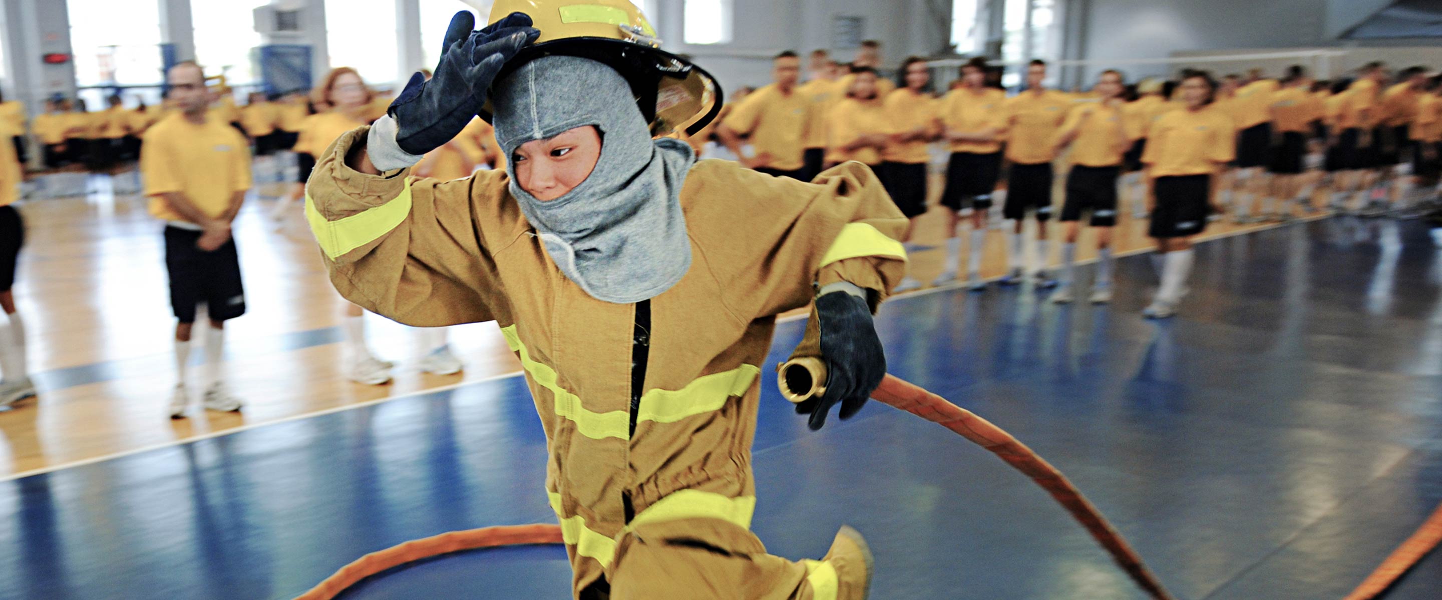 United States Navy recruits learn about fighting fires at boot camp