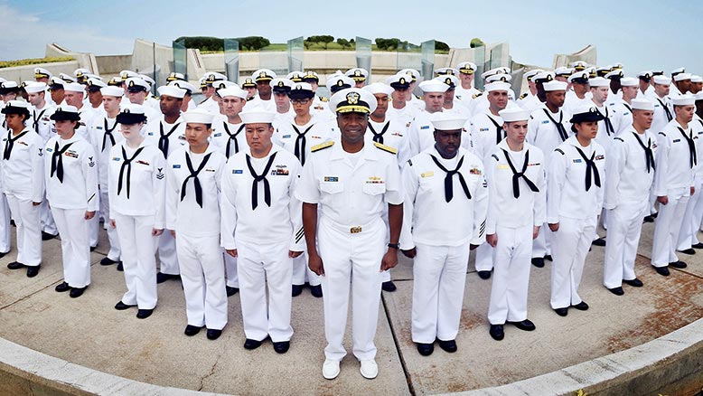 Navy Sailors pose for a picture in military stance