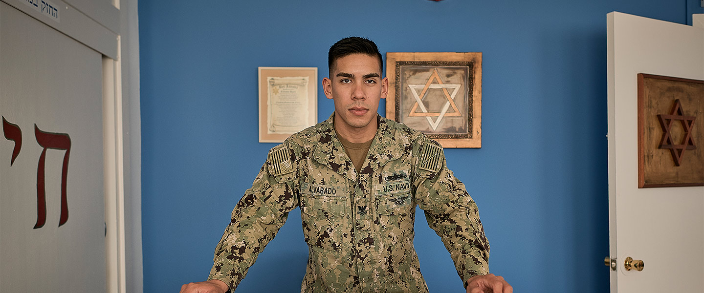 Justin Alvarado, Navy Religious Program Specialist, poses for an image at the Navy base in Rota, Spain