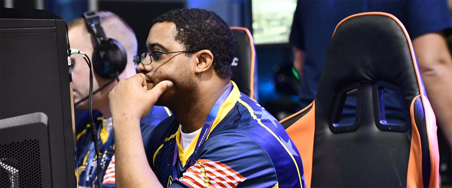 Navy Sailor and Esports gamer PS1 Keith Cherry at competition with his Goats and Glory teammates 