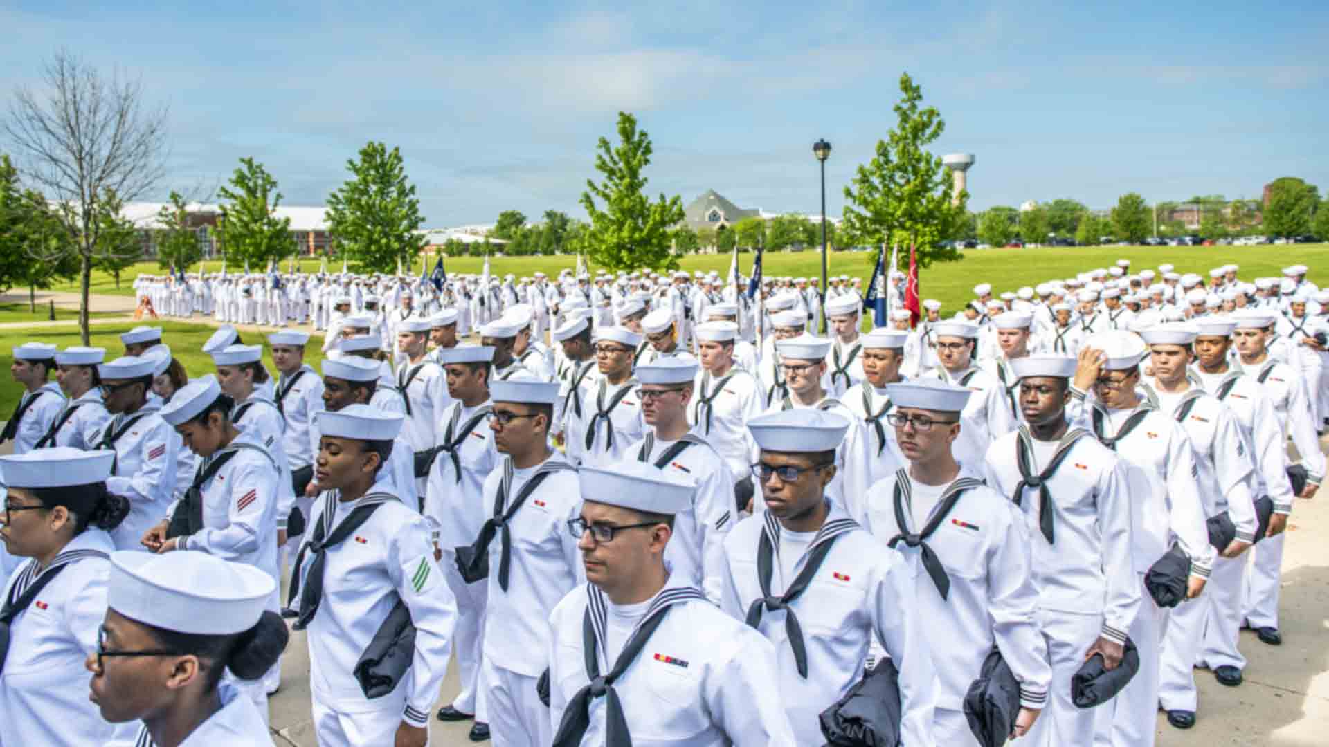 Navy Sailors pose for a picture in military stance