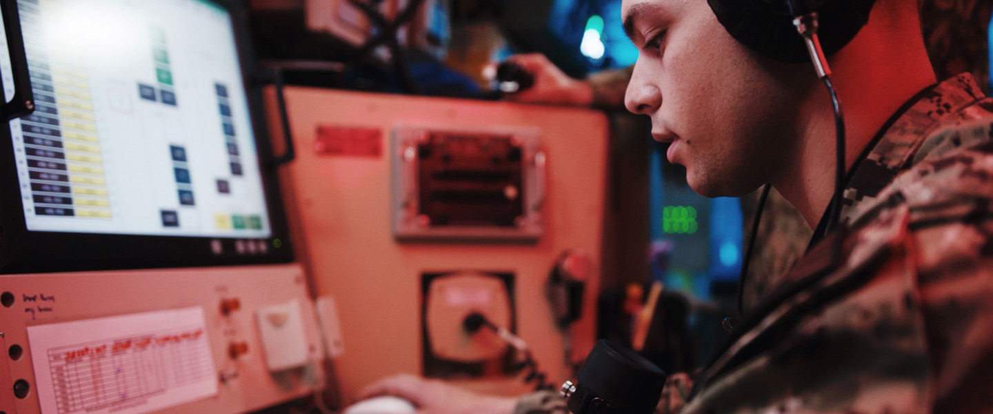 A United States Navy Missile Technician monitors advanced electronic equipment and electromechanical support systems used in submarine strategic weapons systems.