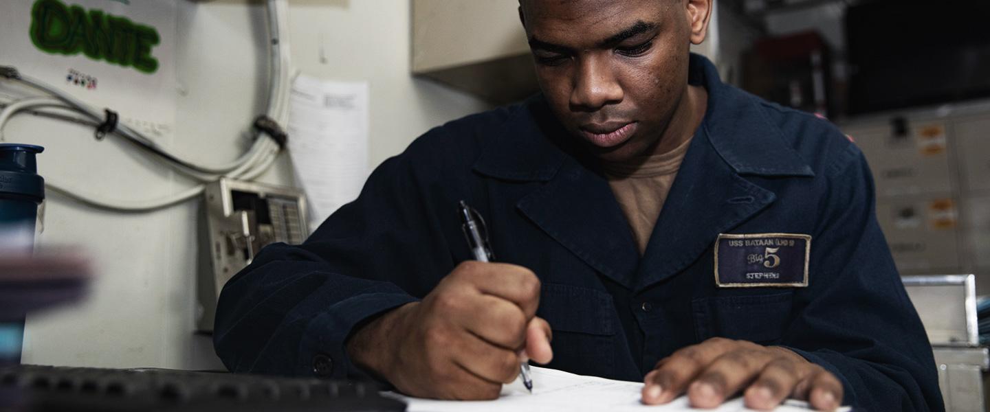 Yeoman Seaman Dante Stephens, assigned to the amphibious assault ship USS Bataan (LHD 5), performs yeoman duties in the Yeoman Office.