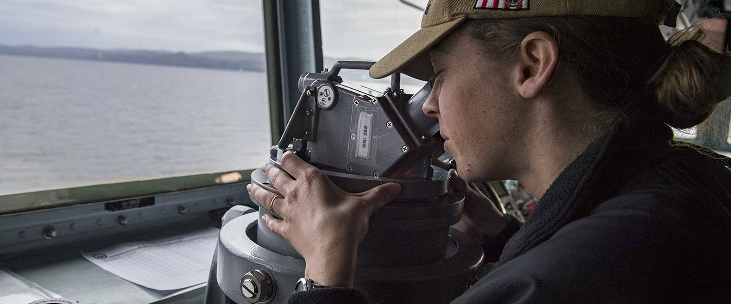 A Navy Intelligence Officer commands the conning officer station aboard the Arliegh Burke-class guided-missile destroyer USS Carney.