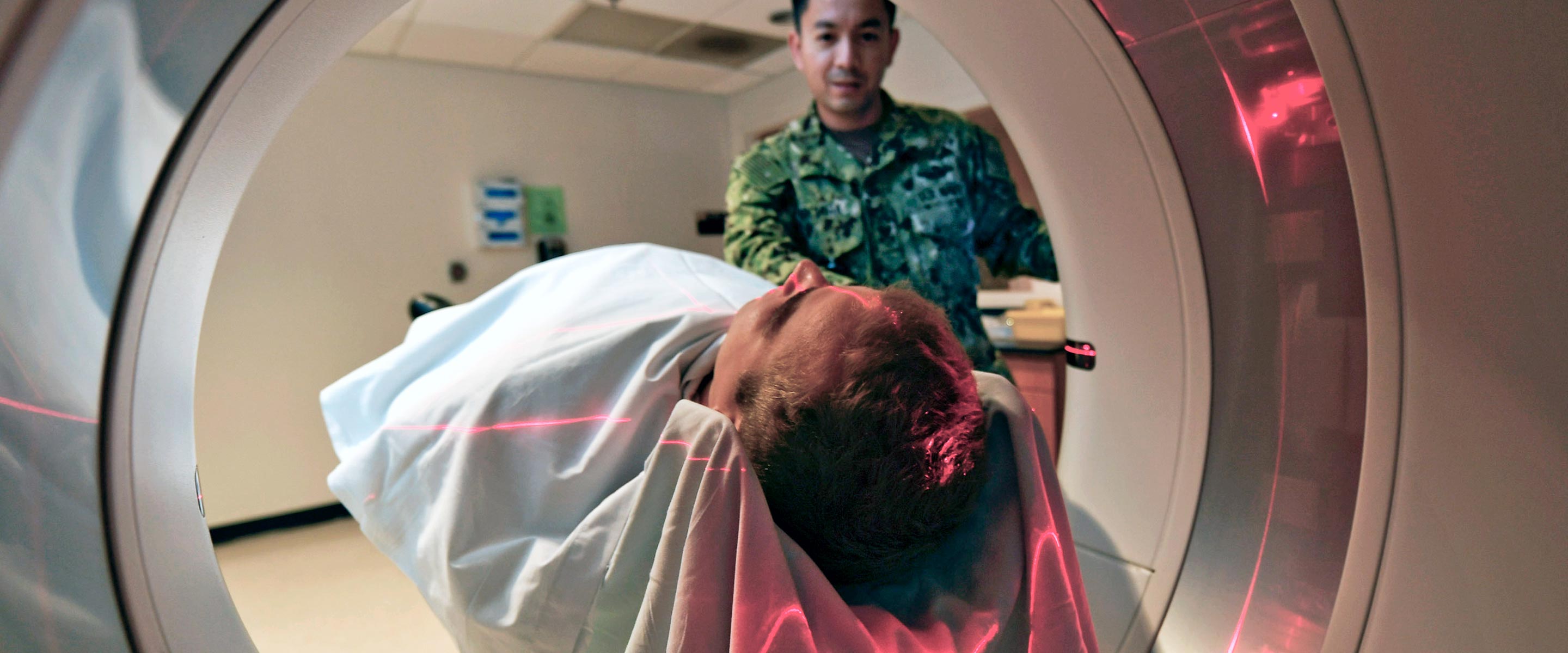 Navy Radiation Health Specialist operates a medical machine