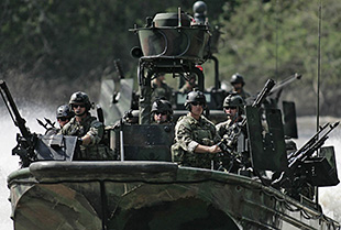 Special Warfare Combatant-Craft Crewman conduct special reconnaissance in a small boat