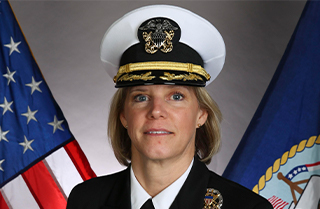 Official United States Navy headshot of Captain Amy Bauersnchmidt, Helicopter Pilot