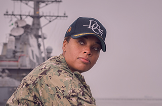 Official United States Navy headshot of Captain Kelley Jones, Surface Warfare Officer