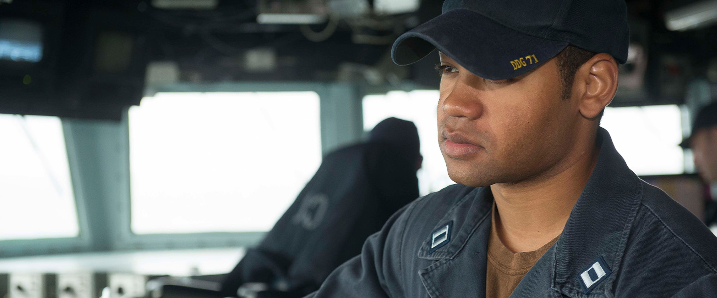 Navy Officer standing watch on the bridge of a DDG Destroyer