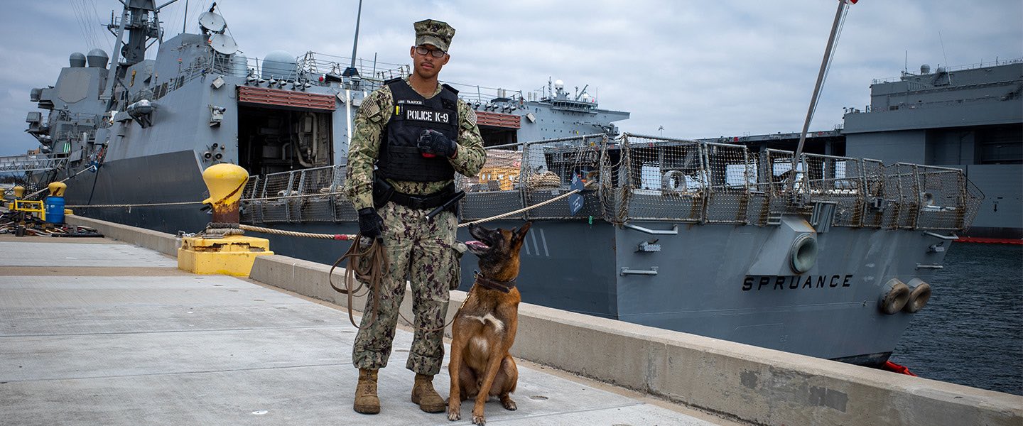 A United States Navy Master-At-Arms and his Military Working Dog. 