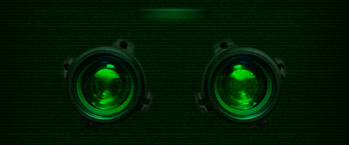 close-up of surveillance equipment, with green light emitting from the center