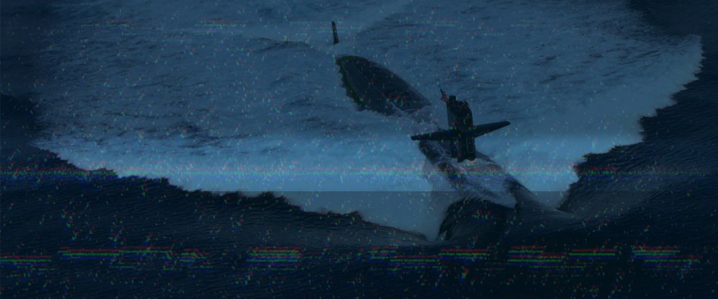 A surfaced Los Angeles-class fast attack submarine in transit through the ocean.