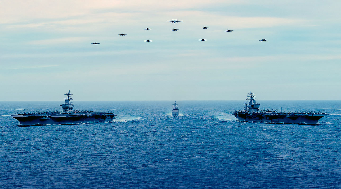 US Navy's Theodore Roosevelt and Nimitz Carrier Strike Groups in formation, deploying to 7th Fleet, Indo-Pacific.
