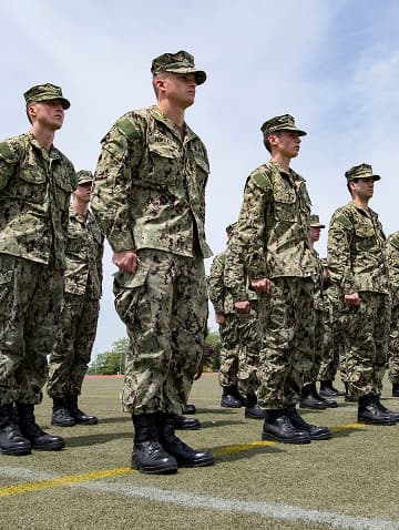 Students in an Naval Reserve Officer Training Corps Program (NROTC) are standing in military formation during a drill.