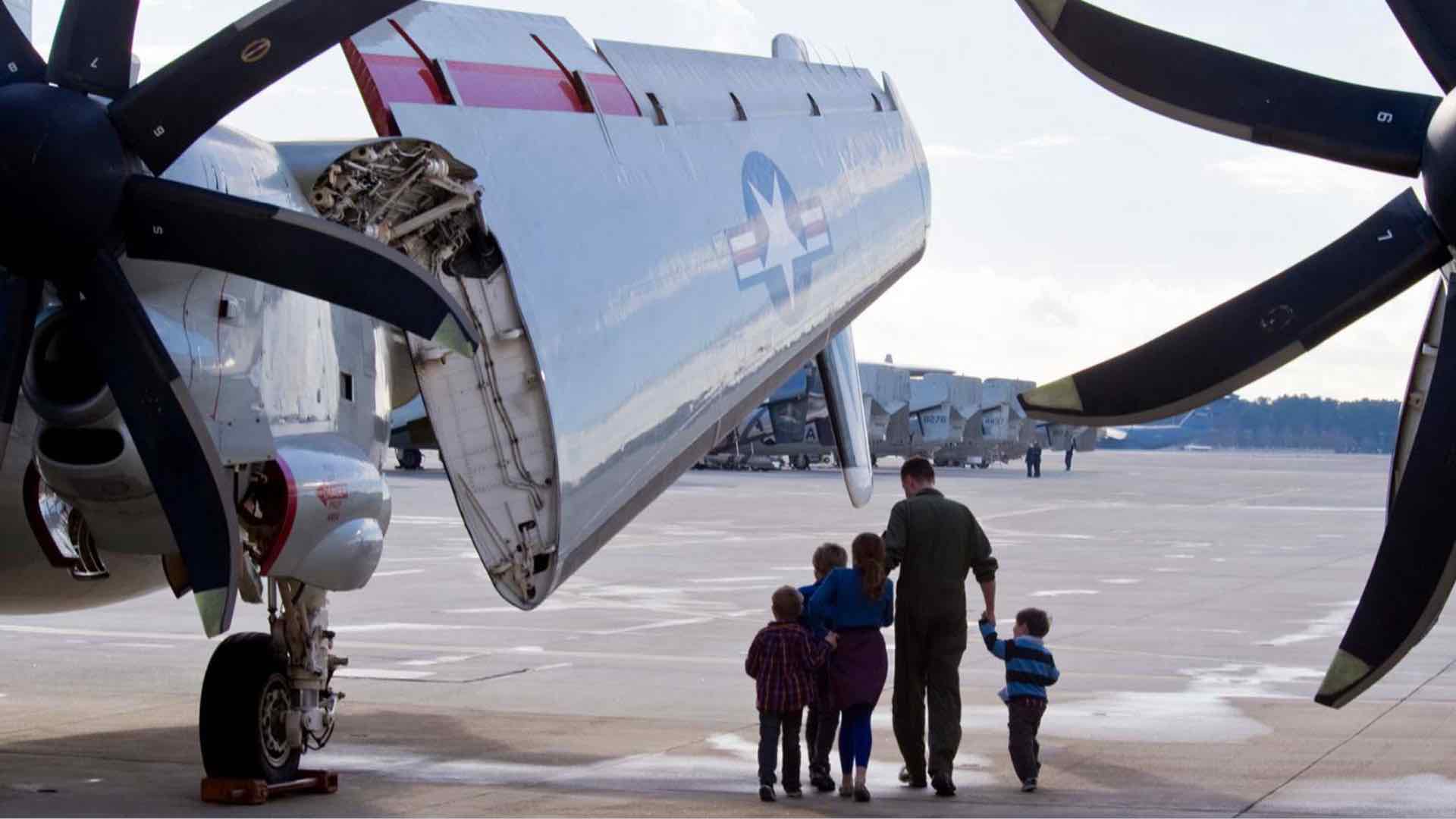 Navy Family with Kids Viewing Aircraft with Vertical Takeoff