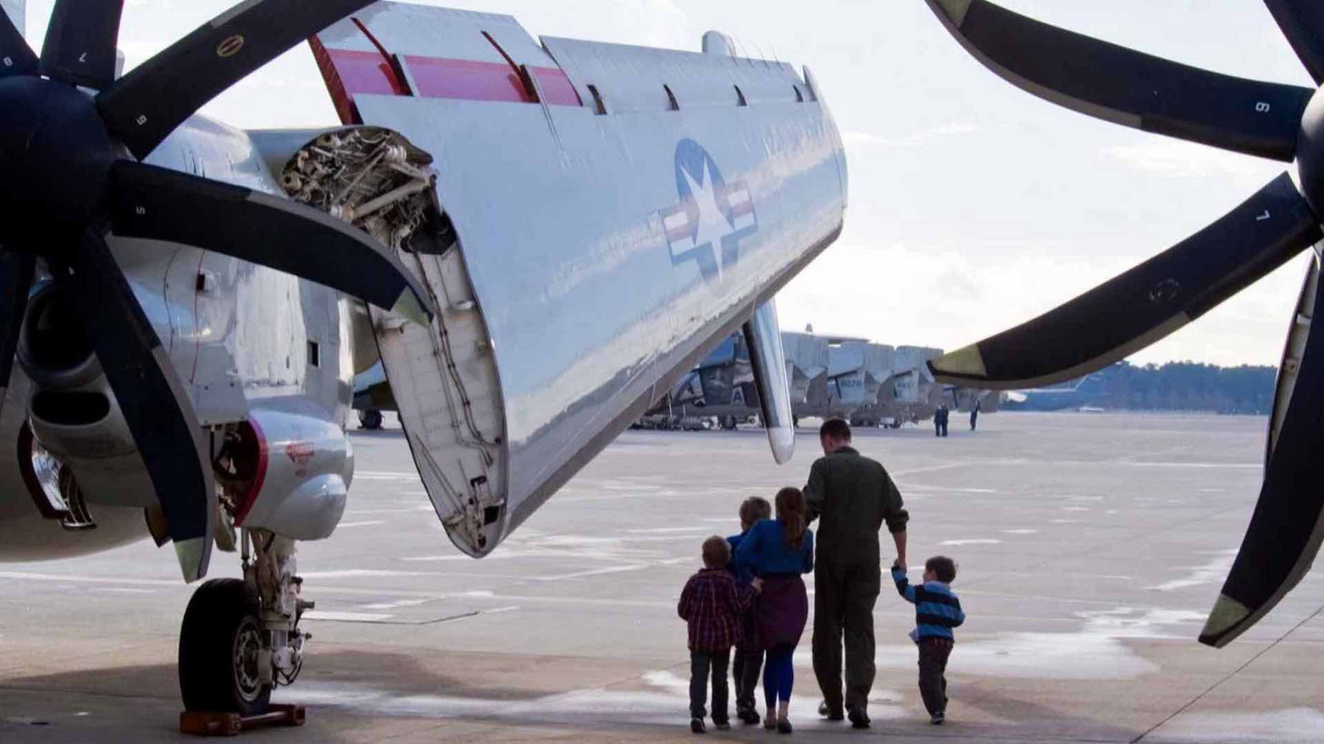 Navy Family with Kids Viewing Aircraft with Vertical Takeoff