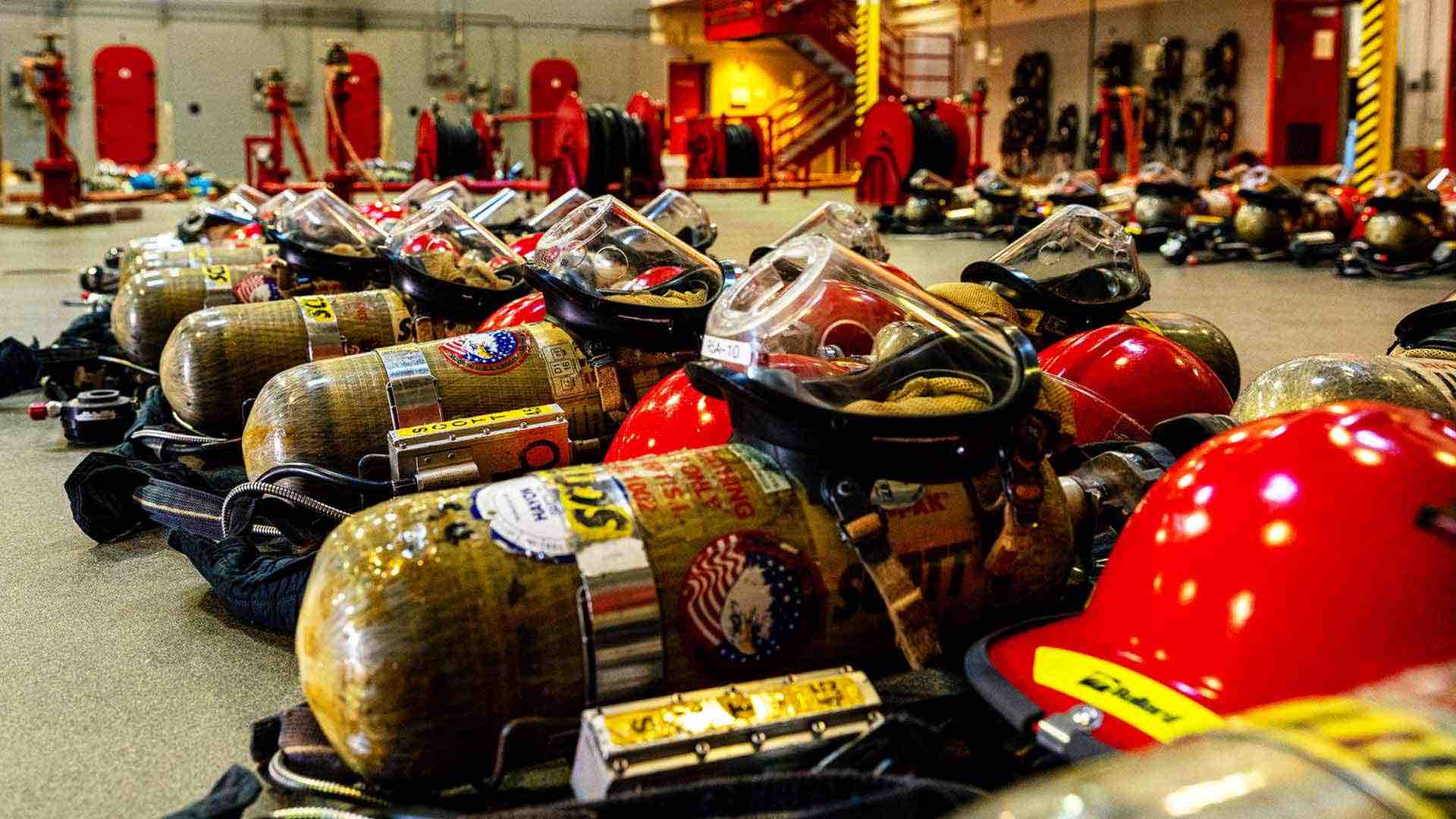 Navy Boot Camp firefighting gear is lined up before fire prevention training at Recruit Training Command in Great Lakes, IL.