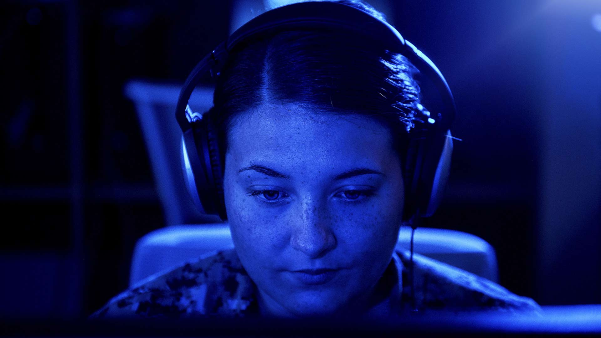 US Navy Cryptologic Technician Myah Riggans interpreting incoming communications on a Navy vessel.