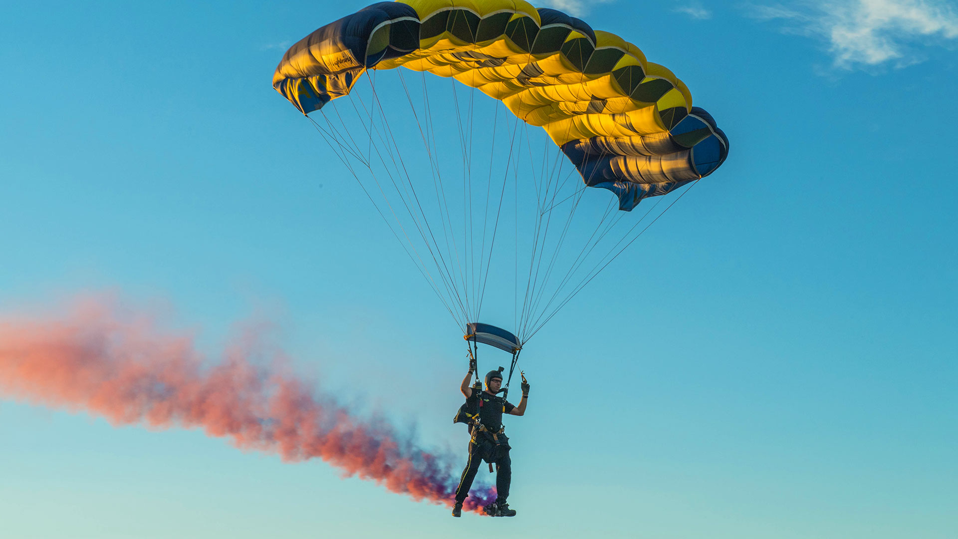 U.S. Navy Leap Frogs parachute team of six flies in tandem formation.