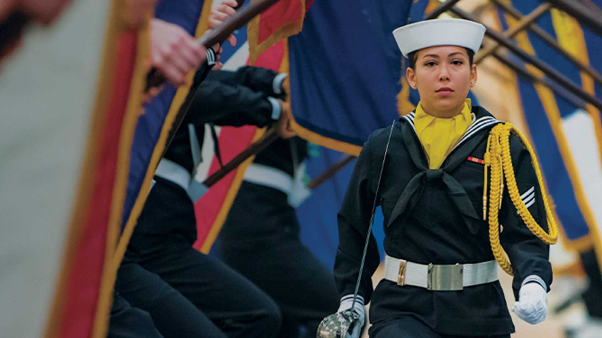 US Navy Sailor Carrying Sword