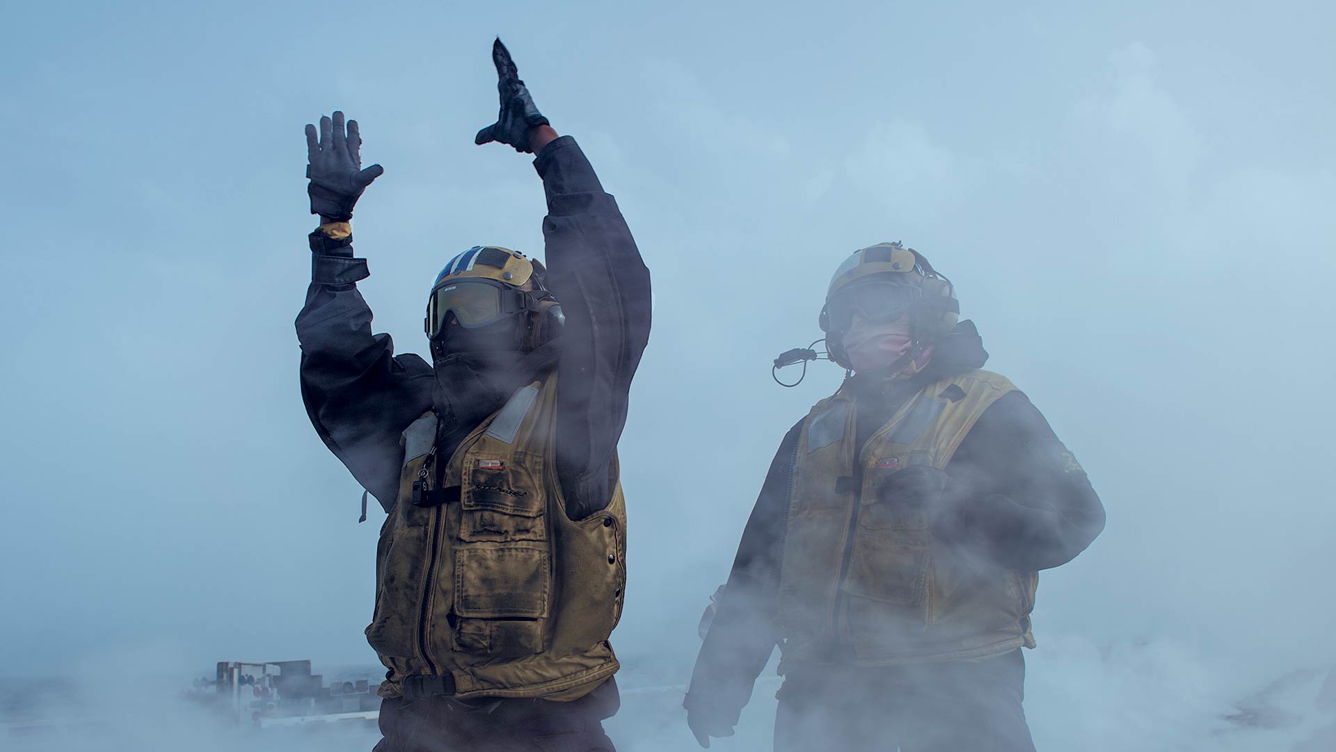 Sailors on deck prepare for a flight.