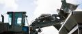 An Equipment Operator in the United States Navy operates a front-end loader on Naval Base Guam.