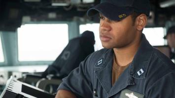 Navy Officer standing watch on the bridge of a DDG Destroyer