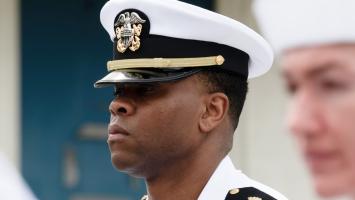 U.S. Navy Officer stands at attention during a uniform inspection.